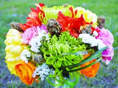 The World’s First Cannabis Wedding Expo bouquet of yellow, red, white, and green flower and cannabis nugs