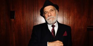 Ask Attorney Bruce Margolin older dapper man with hat and beard in suit wearing a red weed tie