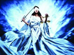 Six Questions to Ask Before Hiring a Lawyer blindfolded woman in long lady justice white robes with sword and scales