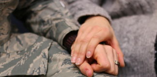 Feds Allow Marijuana PTSD Study To Move Forward military man wearing a ring holding hands with loving female