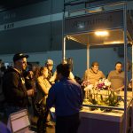 Aessense is Straight Outta Of Mountain View white and purple flowers under light display with crowd surrounding at convention