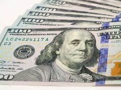 The High Road to Cannabis Payment small fanned out stack of hundred dollar bills focusing on ben franklin