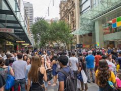 Is Canna Christmas (420) Green Answer to Black Friday? large crowd of people shopping on black friday at outdoor mall