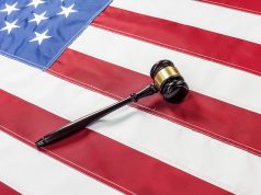 CARERS Act: Panacea Or Pipe Dream? american flag with courtroom gavel