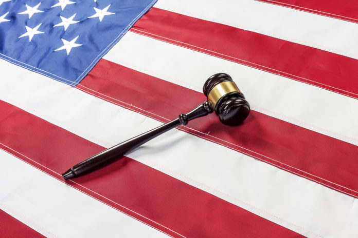 american flag with courtroom gavel