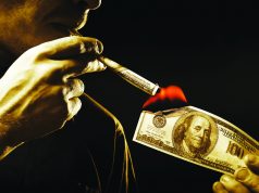 Can Regulation Turn Your Investment Into Smoke? man burning hundred dollar bill and smoking hundred dollar joint