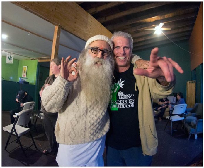 swami and tim sallaway man with long white beard posing with another gentleman