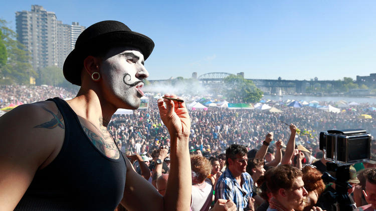 A man smokes during the 4/20 marijuana rally at Sunset Beach in Vancouver, Canada. (Jeff Vinnick/Getty Images)