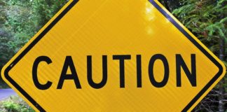 Top Trump Administration Official Says Cannabis is ‘Not Safe’ Caution sign mg magazine