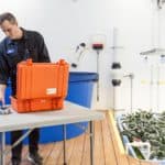 Orange Photonics Illuminates Field-Testing With LightLab Orange Photonics staffer working