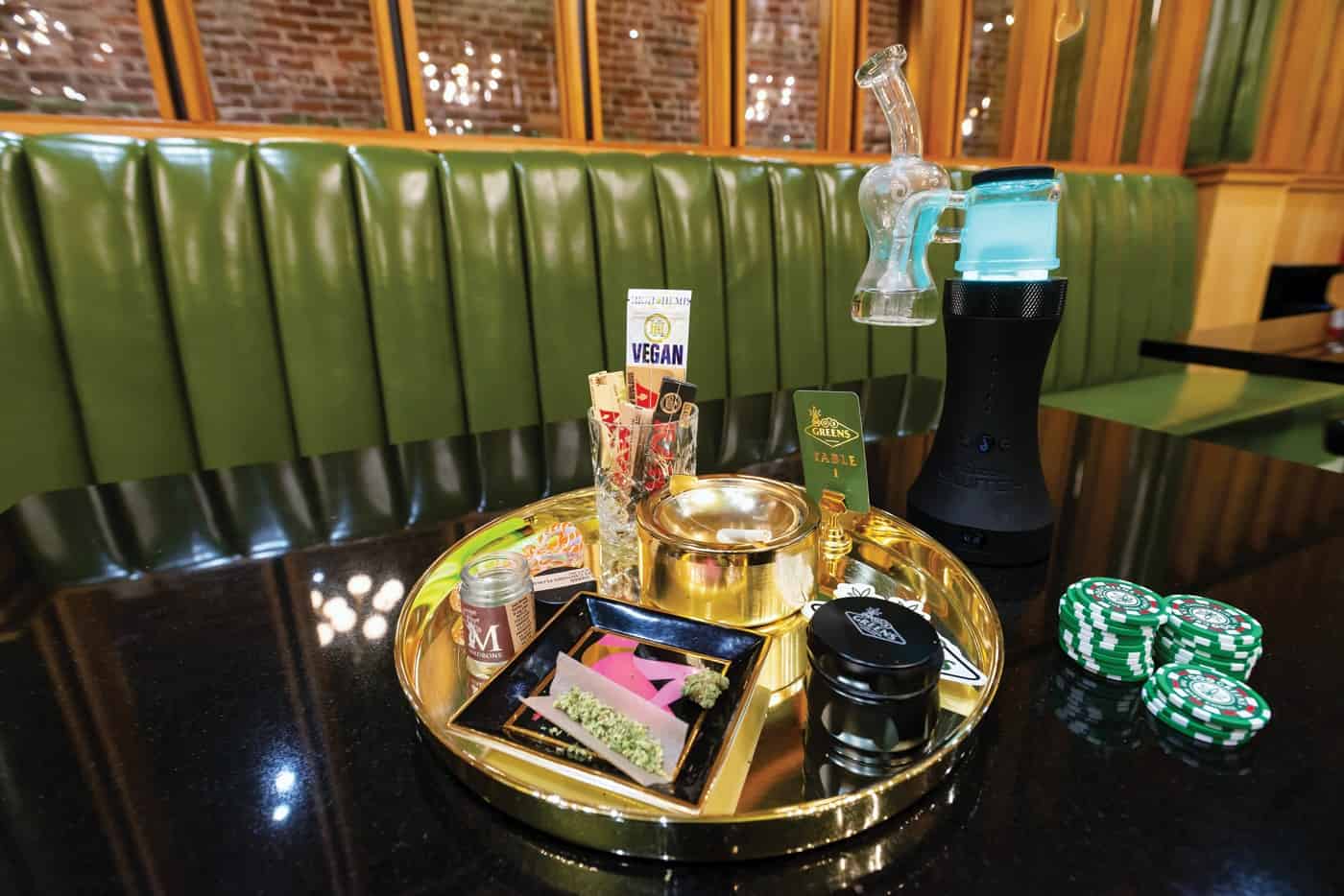 Moe Greens High Roller lounge table with cannabis products displayed