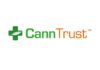 CannTrust Logo white background cann in green trust in black to the left of the text is a green medical cross
