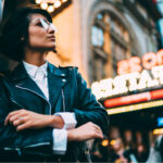 Refresh or Rebrand: Do You Know the Difference? Hipster pondering refresh or rebrand in front of neon sign mg Magazine mgretailer