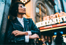 Refresh or Rebrand: Do You Know the Difference? Hipster pondering refresh or rebrand in front of neon sign mg Magazine mgretailer