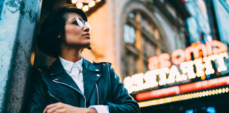 Refresh or Rebrand: Do You Know the Difference? Hipster pondering refresh or rebrand in front of neon sign mg Magazine mgretailer