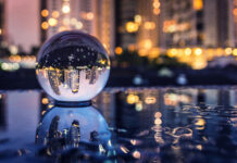 5 Signs It’s Time to Rebrand Glass ball reflecting city at night Clover Collective rebranding Ake13bk mg Magazine mgretailer