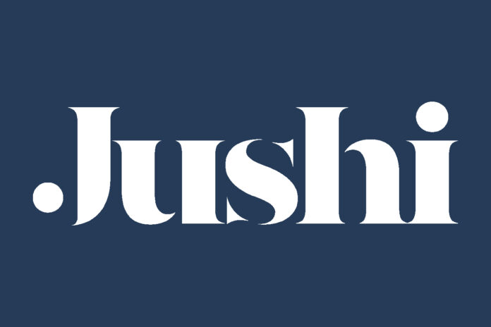 jushi logo white text dark blue background