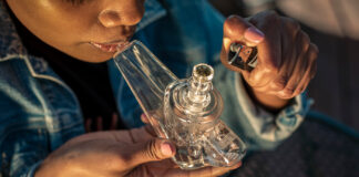 GRAV: Growth on Their Own Terms Woman using GRAV glass mg Magazine