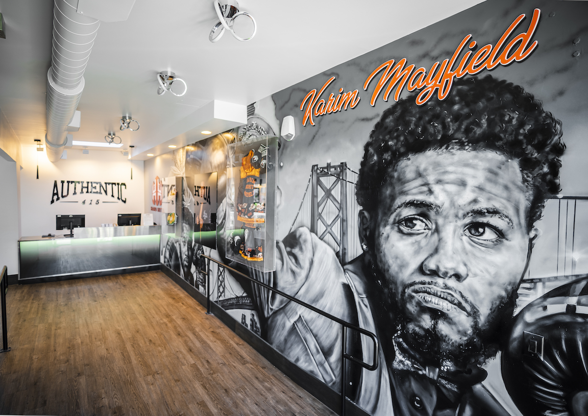 dispensary wall with mural image of karim mayfield