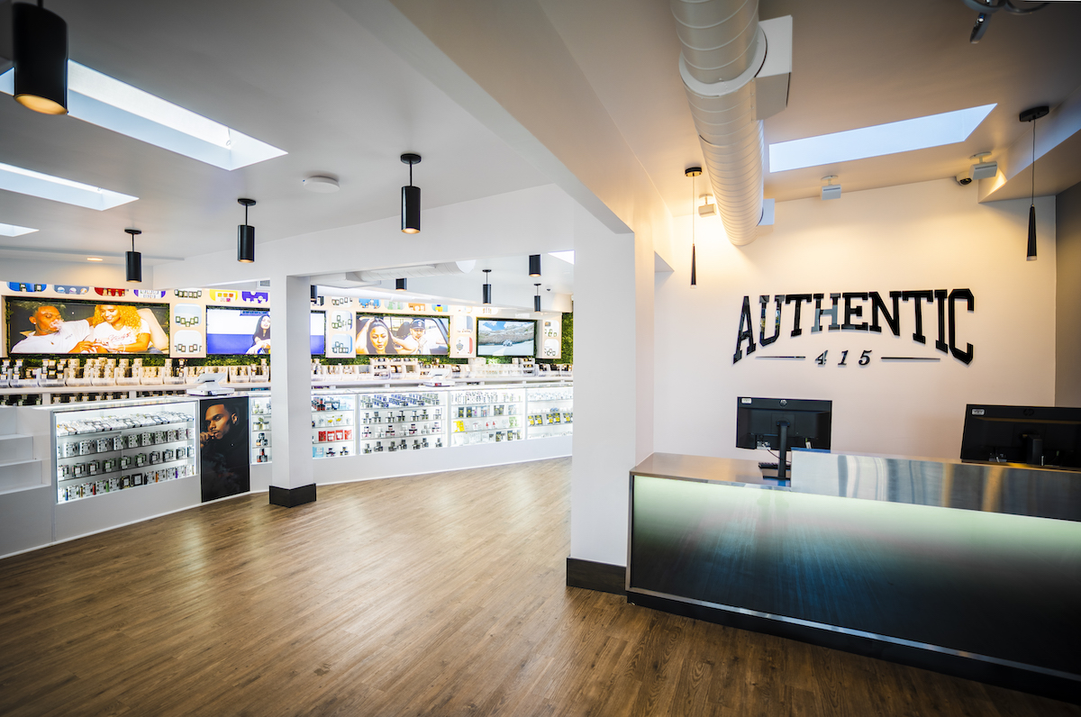 dispensary interior light wood floor and white displays cases and walls
