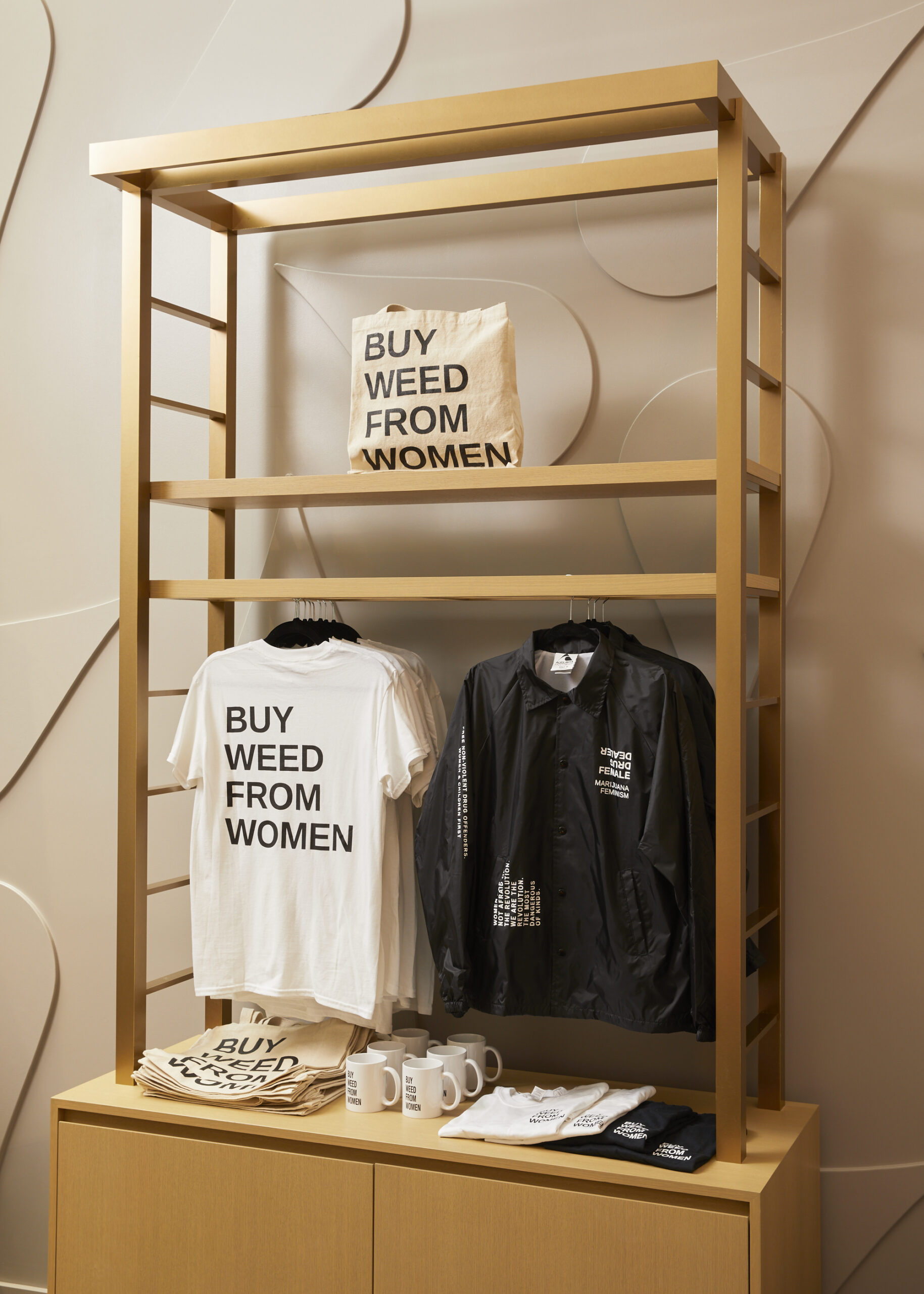 display with clothing that says buy weed from women 