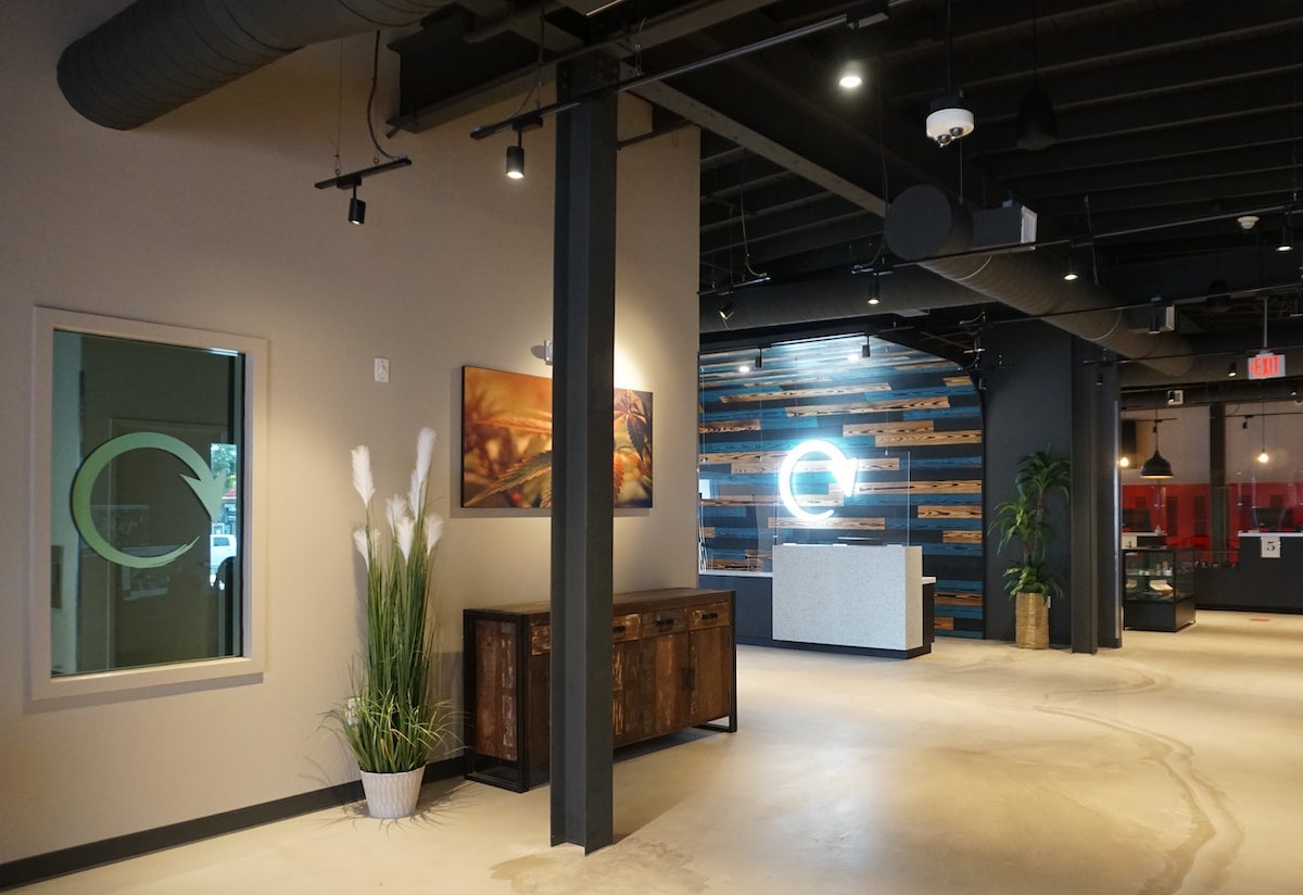 Dispensary interior multicolored blue and wood wall with high ceilings and industrial chic design