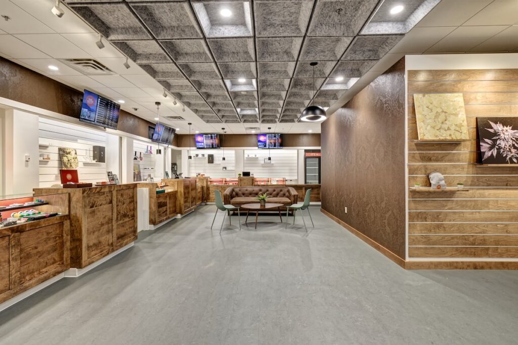 dispensary interior gray floor spacious room wooden counters and bright lighting