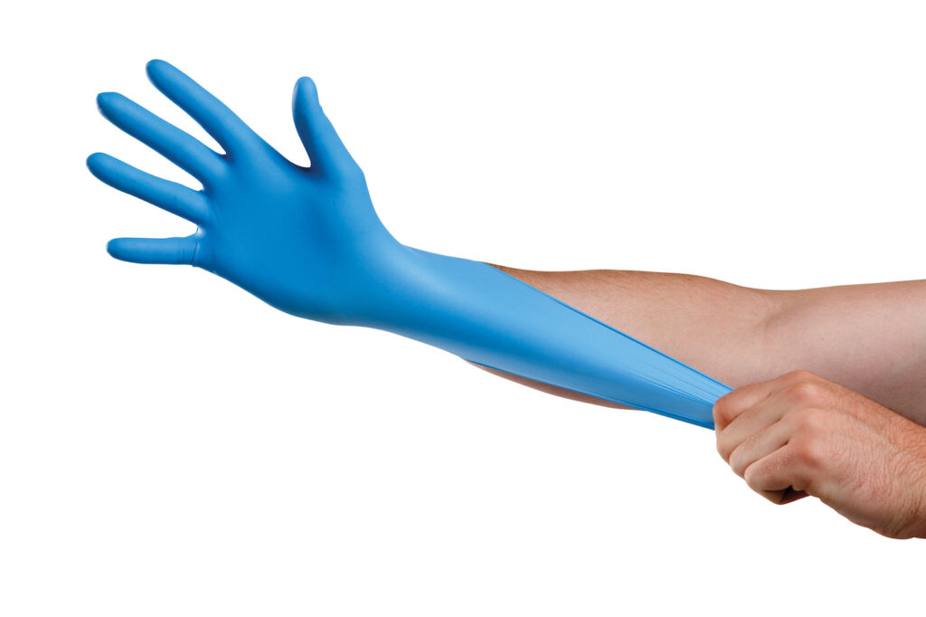 a blue disposable gloves on a hand