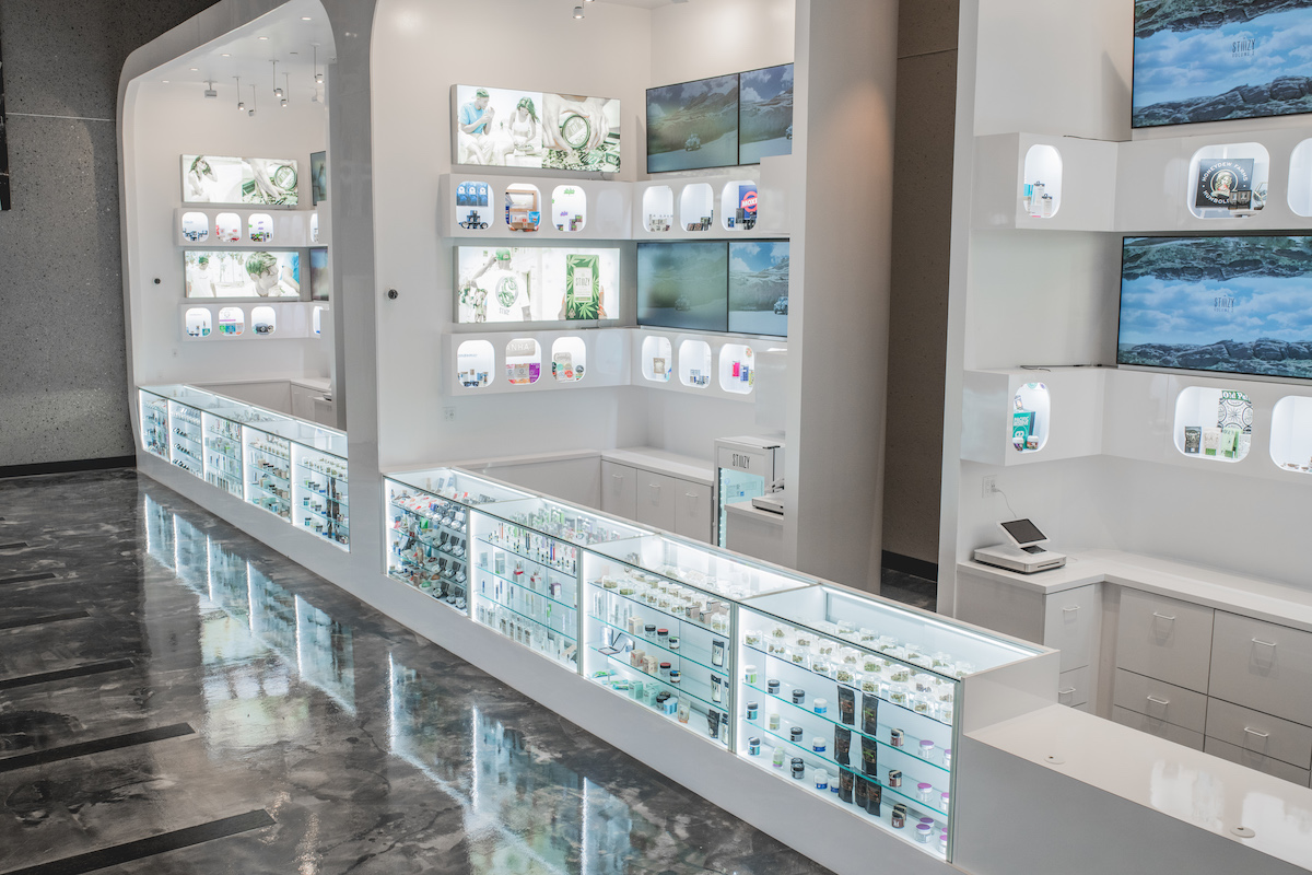 display cases in a stark dispensary with white walls and shiny marble floors