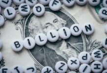 The Cannabis Industry’s Massive Potential for 2022 white and black letter beads spelling billion on top of a one dollar bill