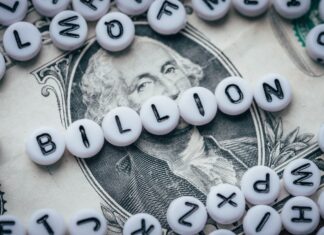 The Cannabis Industry’s Massive Potential for 2022 white and black letter beads spelling billion on top of a one dollar bill