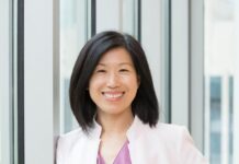 Wana Brands Names Finance and Business Leader Sandy Li Chief Financial Officer a photo of sandy li in a white blazer and a lavender shirt smiling with black shoulder length hair and a big smile