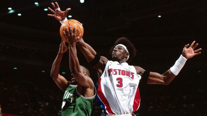ben wallace blocking a lay up with his arm stretched out above the shooter
