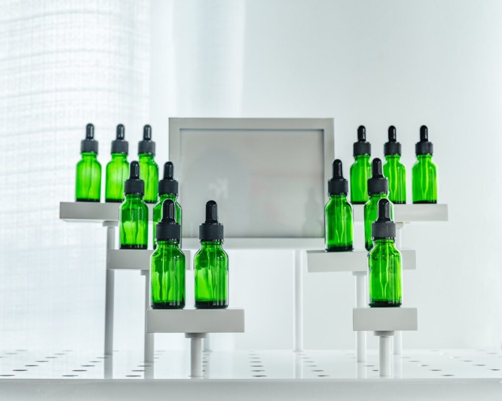 tincture bottles in lime green on a display shelf