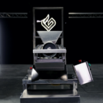 GreenBroz Inc. Launches the Model G Precision Grinder + Destemmer, Transforming Cannabis Pre-Roll and Extraction Processing Greenbroz industrial grinder front facing view of the stainless steel machine with the green broz G lit up above the grinder