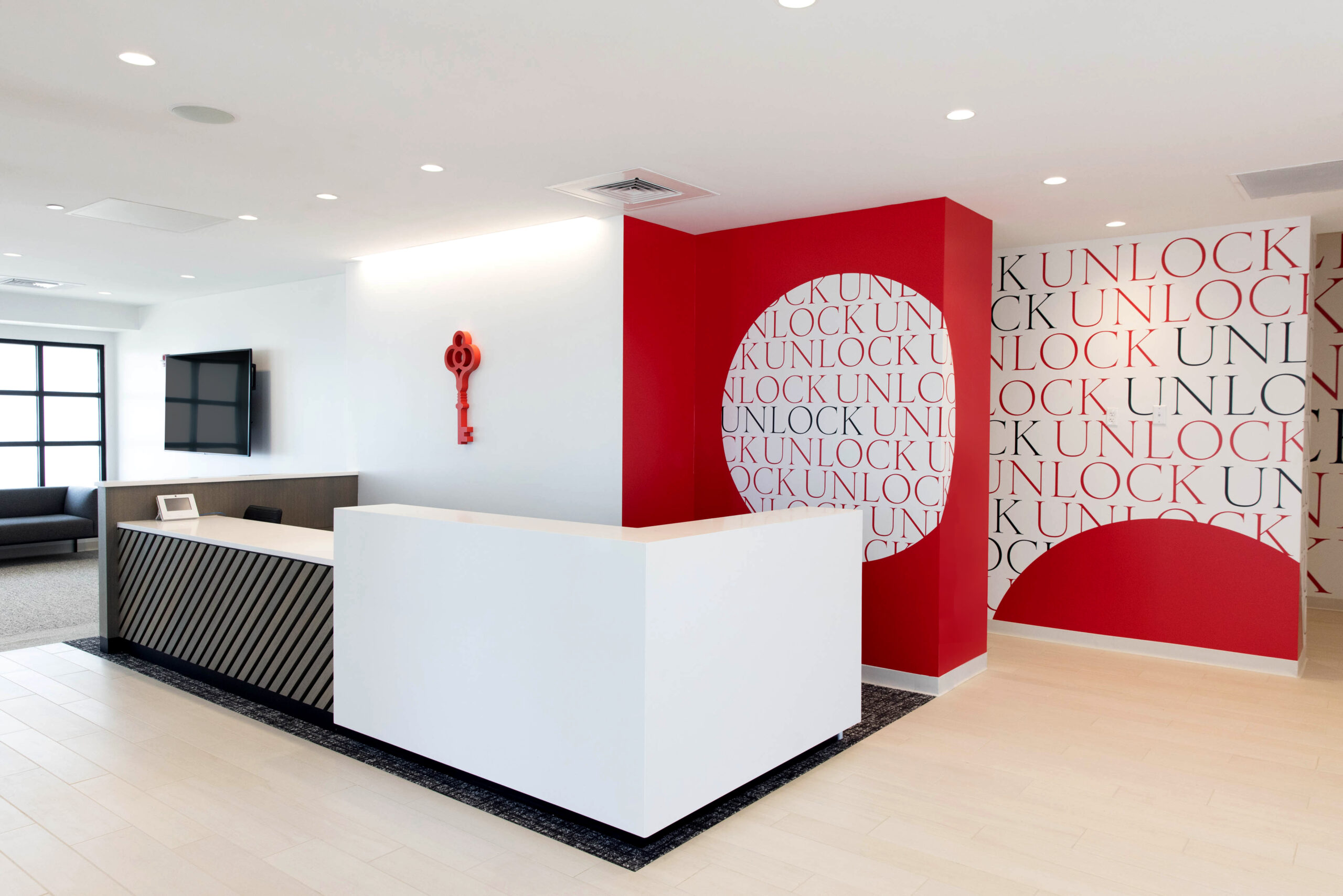 dispensary interior with wood floors and white ceiling and red accents