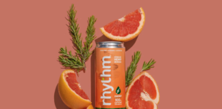 rhythm™ Sparkling Hemp Beverages Announces Re-Brand and Enhanced Product Formulations rhythm seltzer coral background with orange rhythm can in center surrounded by blood orange slices and green sprigs of rosemary