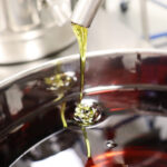 Motif Labs Launches CBN Production close up photo of cbn concentrate drizzling on to a silver dish