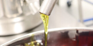 Motif Labs Launches CBN Production close up photo of cbn concentrate drizzling on to a silver dish