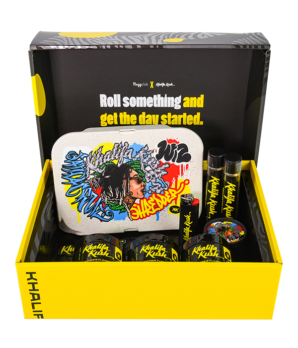 black and yellow box filled with cannabis products the inside of the lid reads roll something and get the day started