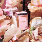 Sundazed Debuts Premium Line of Cannabis Pre Rolls First to Integrate Instagram Filters Into Packaging a light pink preroll box with a matching pack of matches surrounded by pink flowersh
