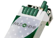 WILD HEMP® and Turning Point Brands (TPB) Partner with Cuban Connection to Expand Distribution to South Africa- WILD HEMP® Hempettes are now available in South Africa a pack of green wild hemp hempette cigarettes with the lid open and two cigarettes emerging from the pack