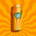 The Boston Beer Company Introduces TeaPot, A New Line of Cannabis-Infused Iced Teas Boston Beer Co Teapot Can covered in orange and yellow sunburst design the background of the image is also a sunburst design that blends seamlessly with the print on the can there is also a green teapot printed on the center of the can with the word teapot printed in white text