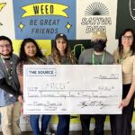The Source+ Donates More Than $11,000 to UNICEF photo of the source plus employees holding a giant check for 11,000 dollars made out to UNICEF