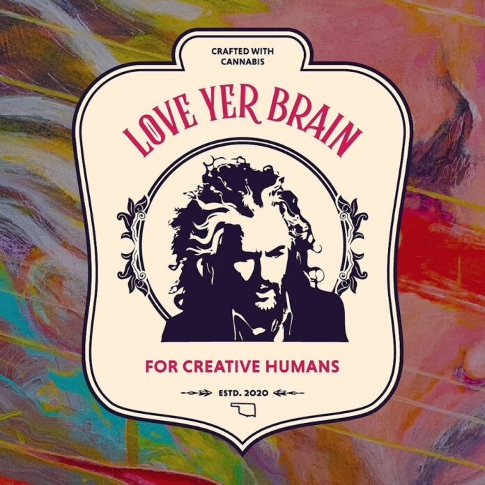 multicolor muted background with cream love yer brain logo in the middle featuring image of man with wild flowing hair and love yer brain in pink capitalized font
