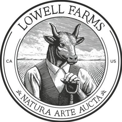 white background black circular logo with a person with the head of a cow in the center and lowell farms printed at the top