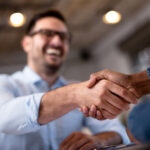 Breaking Up: How to Respond When an Employee Quits two business people shaking hands