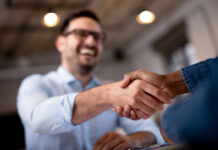 Breaking Up: How to Respond When an Employee Quits two business people shaking hands