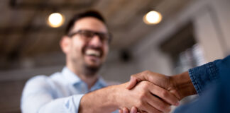 Breaking Up: How to Respond When an Employee Quits two business people shaking hands