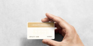 5 Dos and Don’ts for Dispensary Loyalty Programs Hand hold loyalty card template with rounded corners.